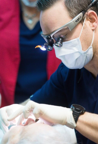 Dr. Tolley placing dental implants in Winchester VA