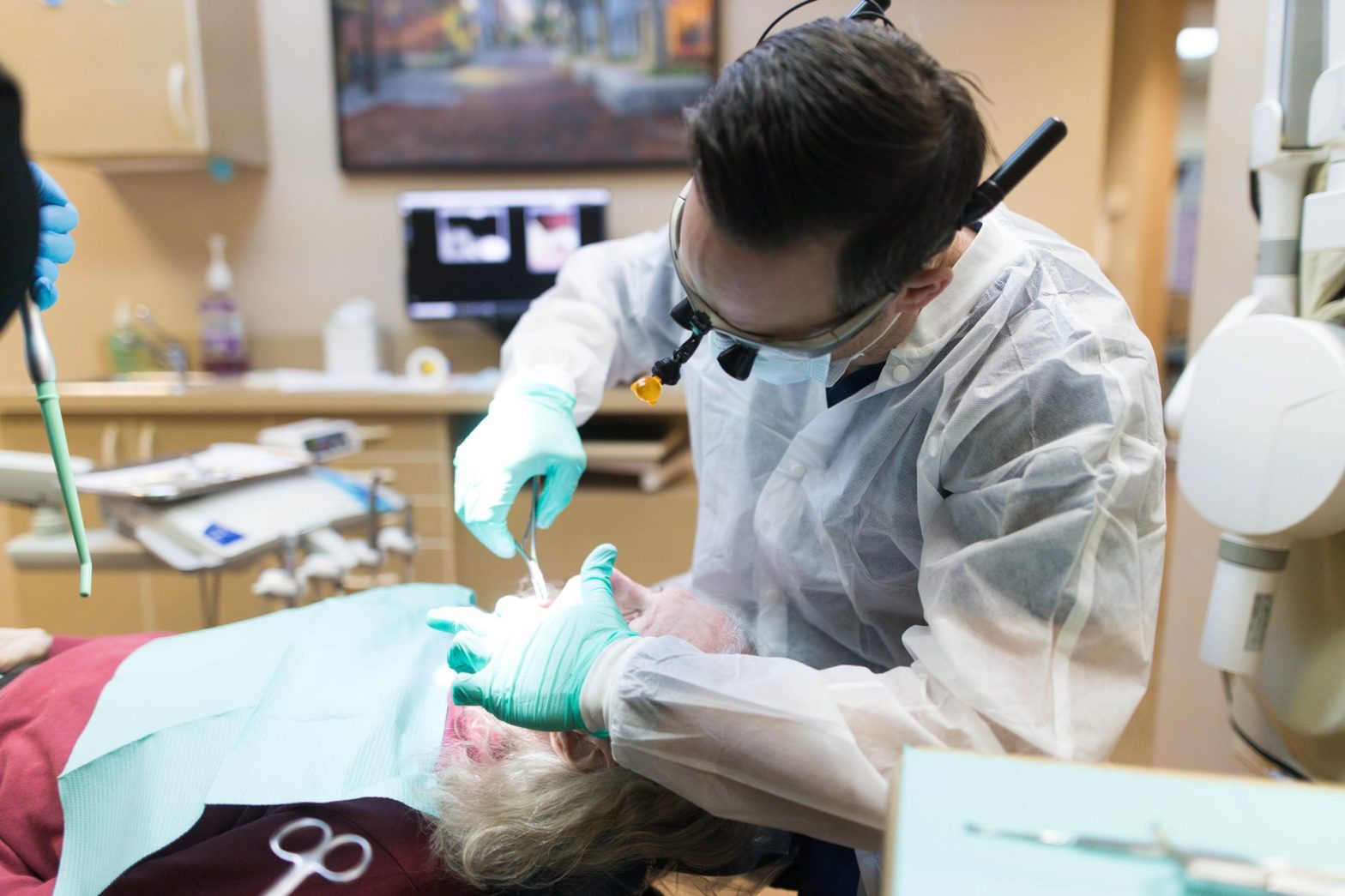 Emergency dentist dealing with a chipped tooth