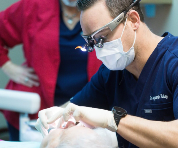 Dr. Tolley placing dental implants in Winchester VA